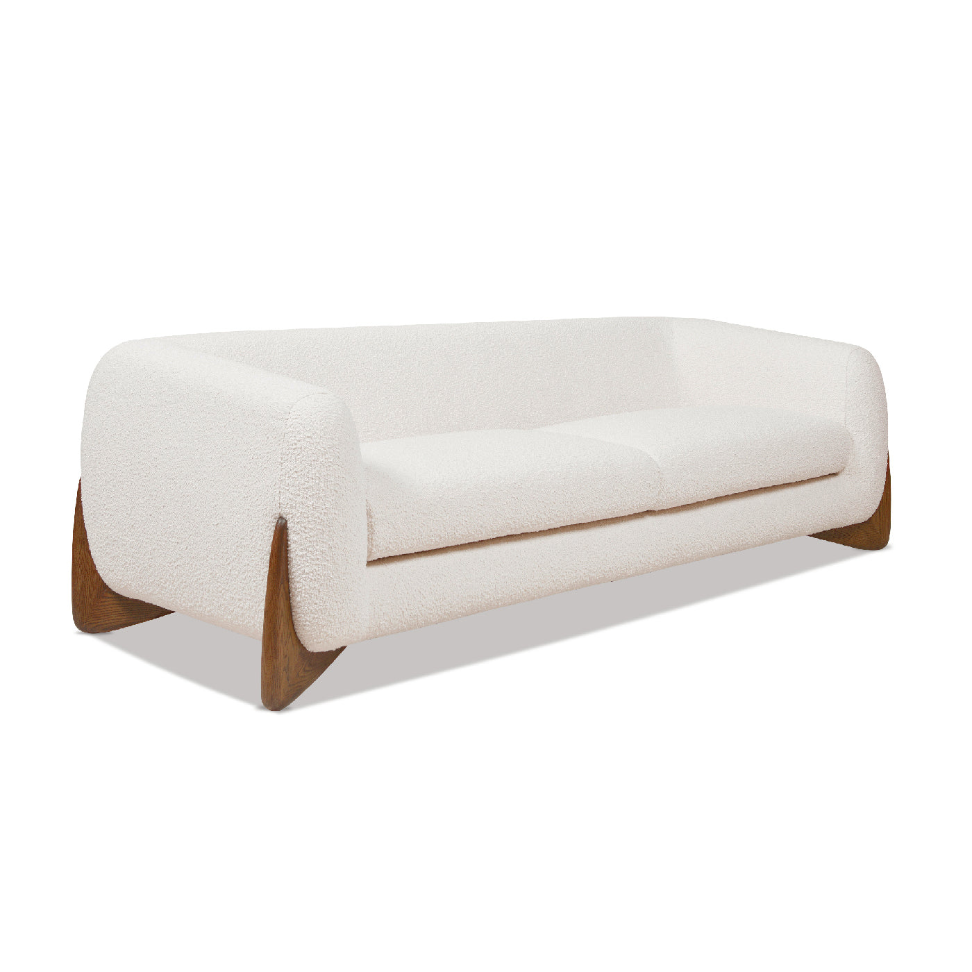 Cream boucle sofa with curved arms and angled wooden legs