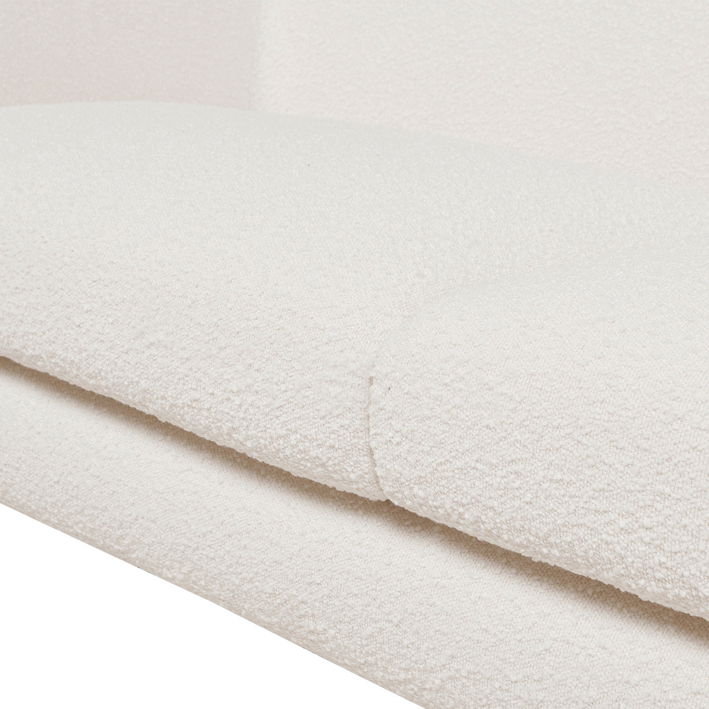 Textured cream fabric upholstery detail on a sofa