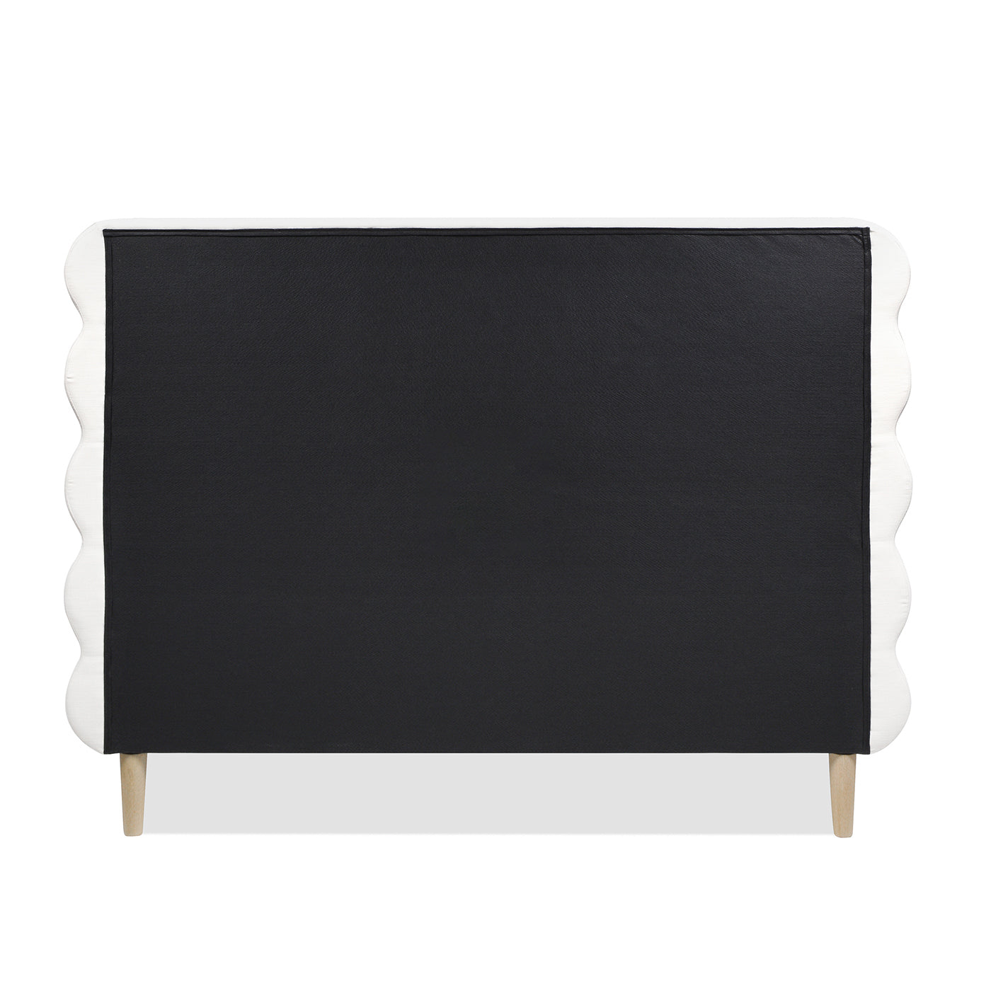 White scalloped headboard with black fabric panel and wooden legs