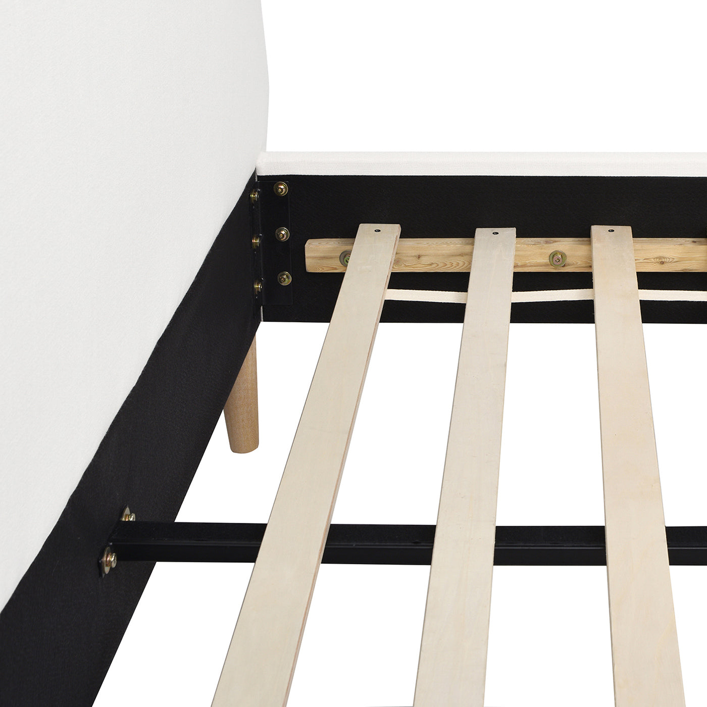 Closeup of a white upholstered bed frames wooden slats and metal support
