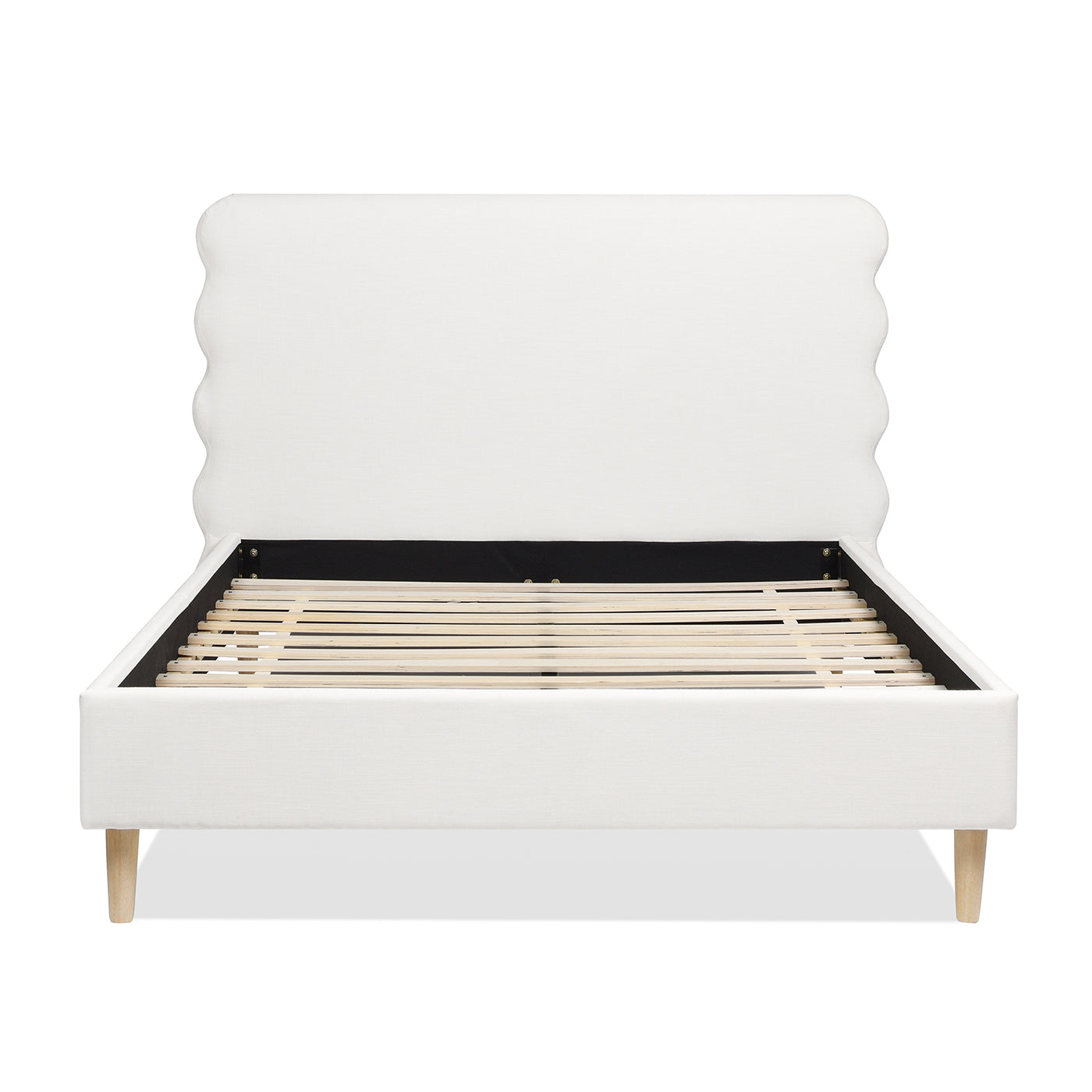 White upholstered bed frame with scalloped headboard and wooden slats