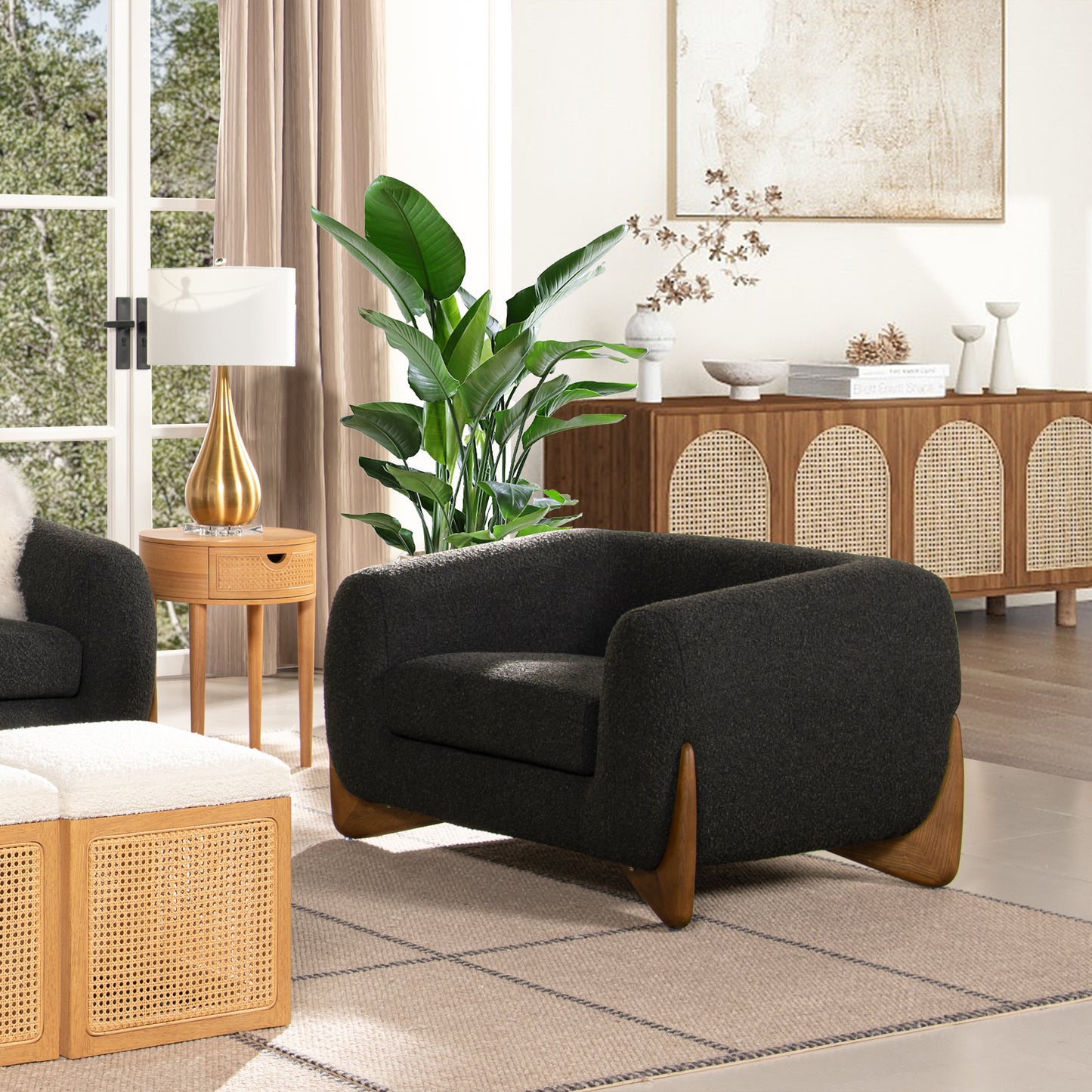 Dark charcoal boucle armchair with curved arms and natural wood legs modern living room accent chair
