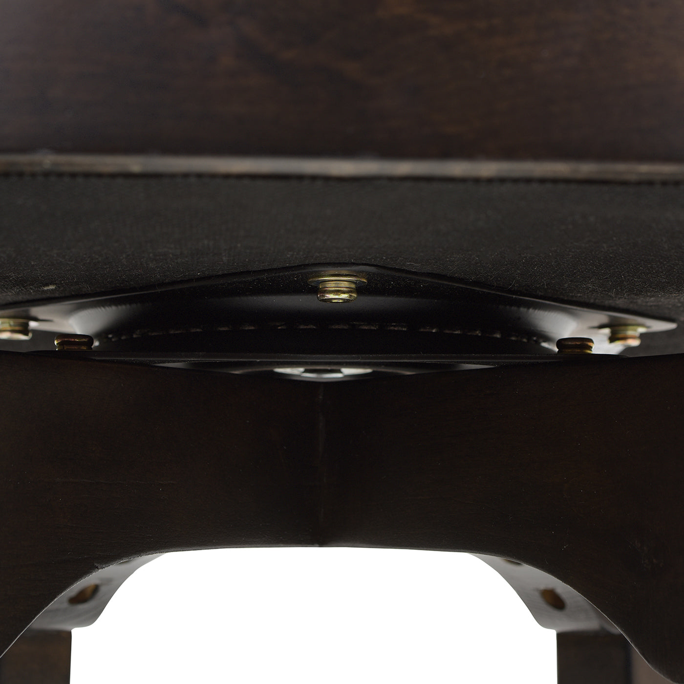 Swivel base mechanism on a dark wood bar stool with visible bolts