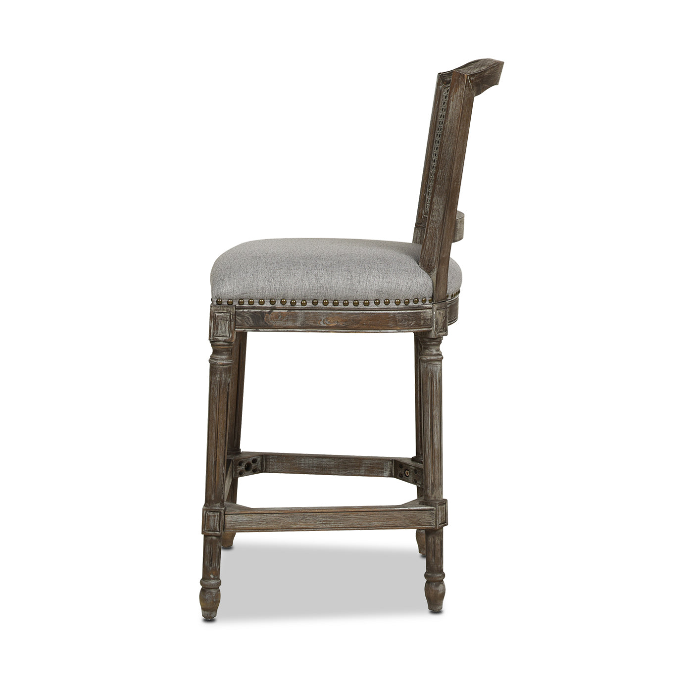Distressed brown wood bar stool with gray upholstered seat and nailhead trim