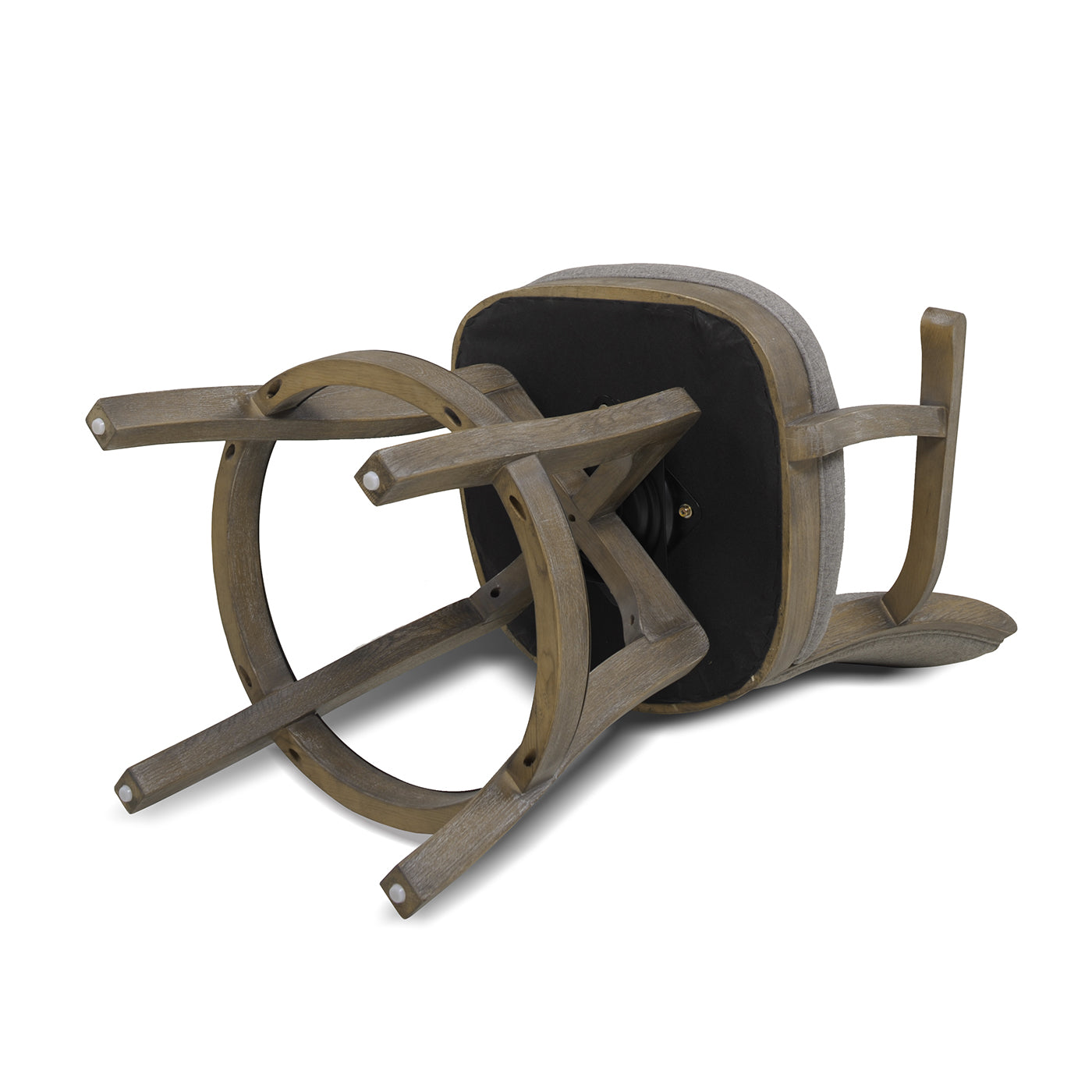 Upside down wooden stool with grey upholstered seat and sturdy leg structure