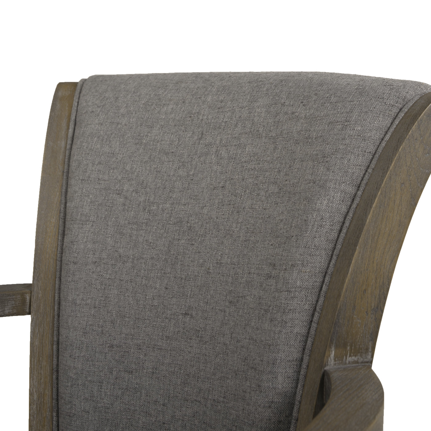 Closeup of grey upholstered dining chair back with distressed wooden frame