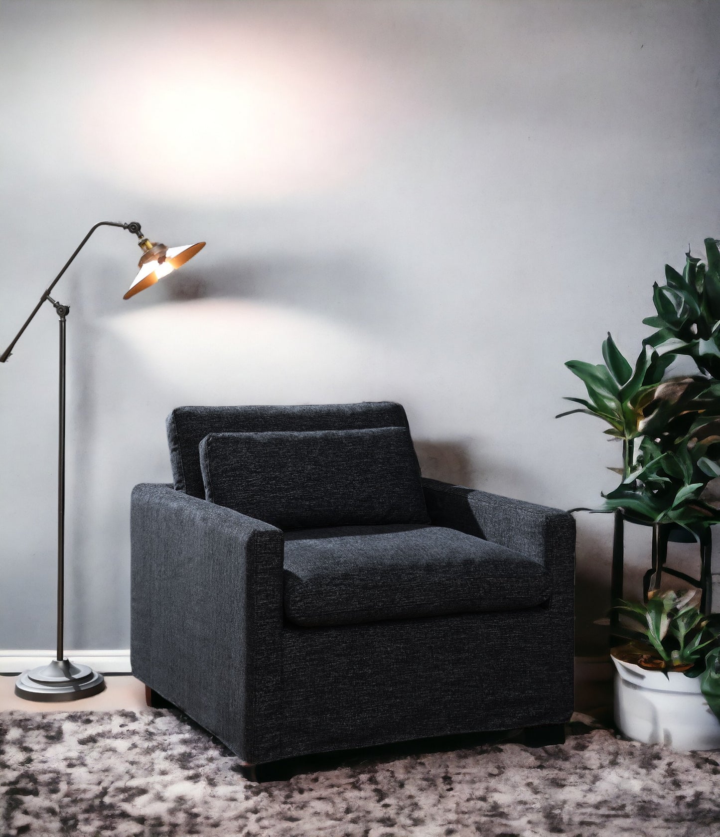 Dark gray upholstered armchair with textured fabric and plush cushions perfect for modern living rooms