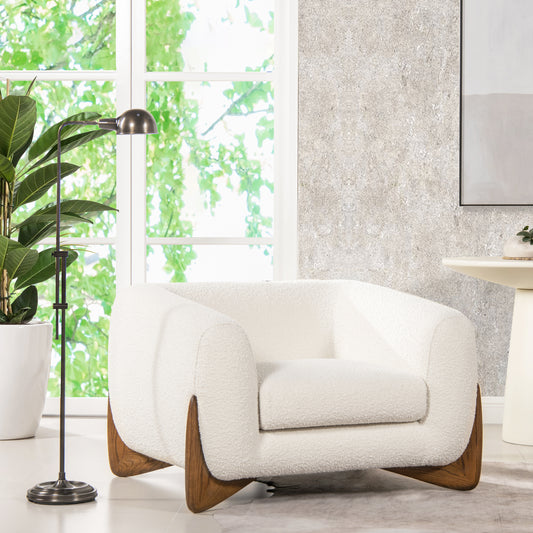 Cozy ivory boucle armchair with distinctive wood accents perfect for modern living rooms
