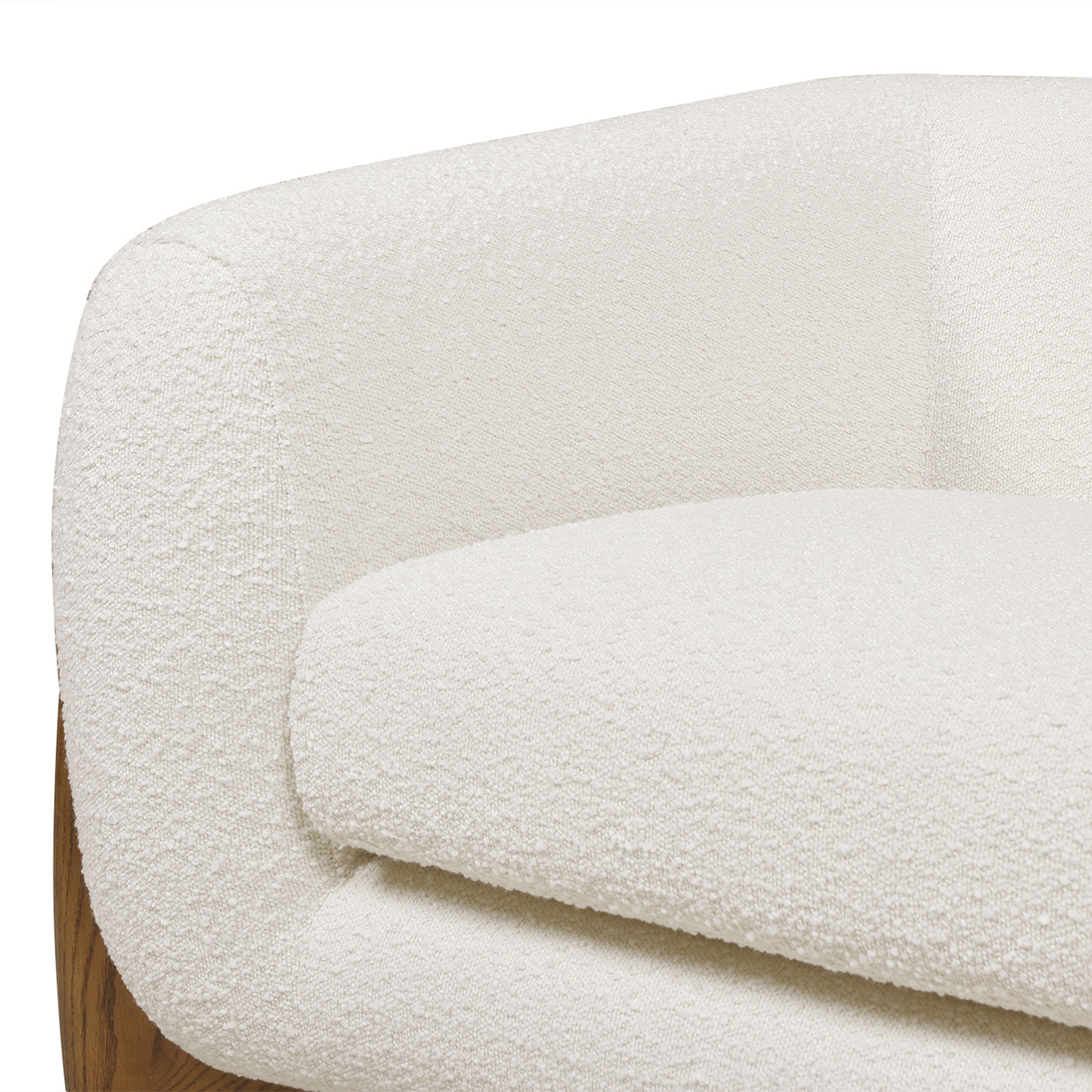 Plush ivory boucle accent chair with rounded silhouette and wooden base