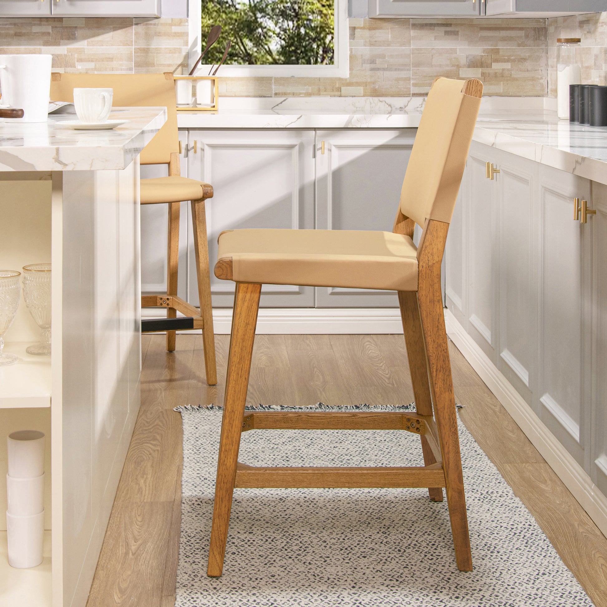 Tan leather and wood bar stool with a modern design perfect for kitchen islands