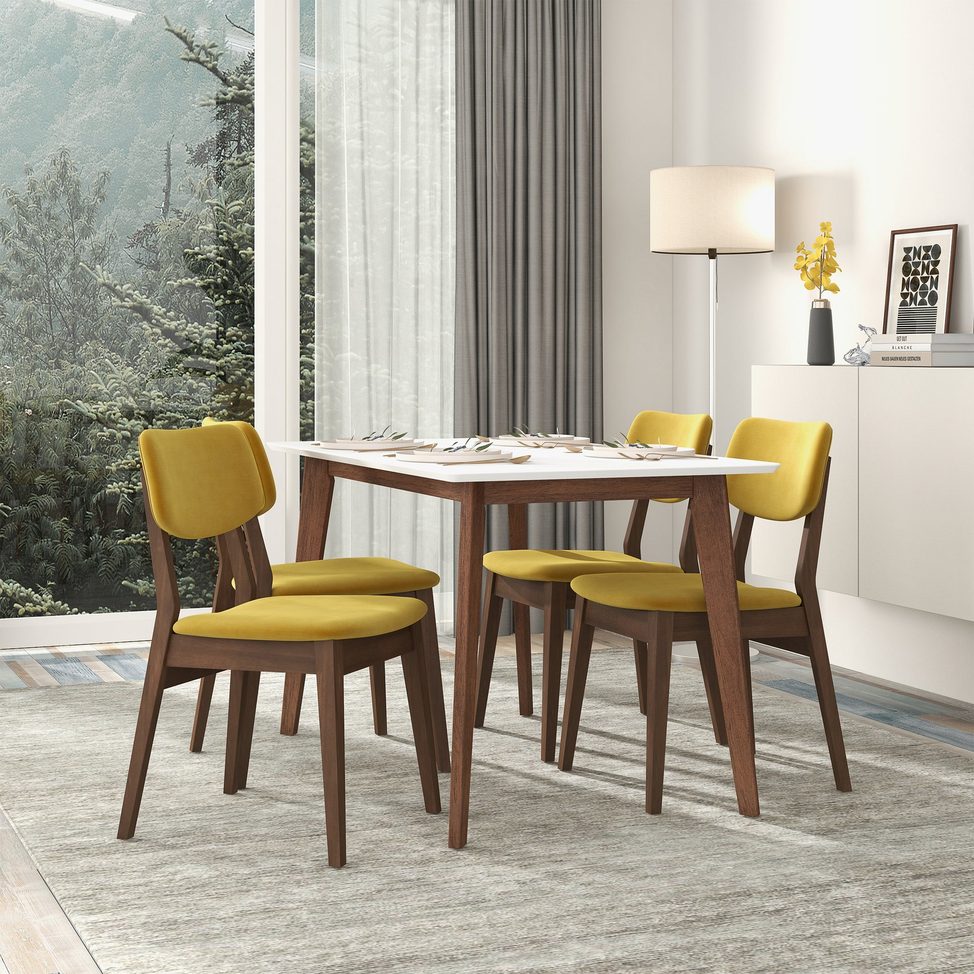Yellow velvet dining chairs with dark wood legs paired with a modern white dining table