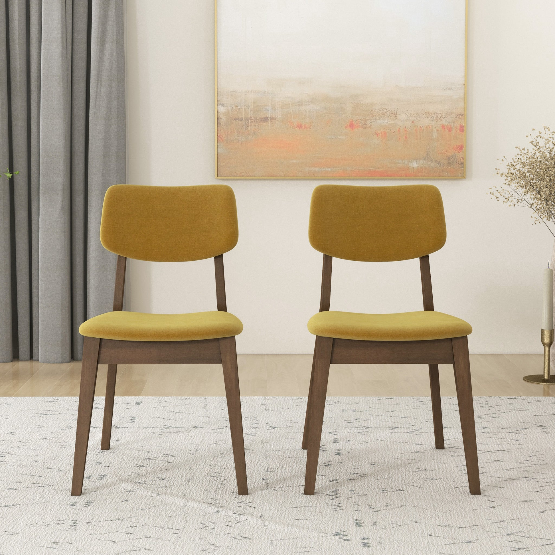 Pair of mustard yellow upholstered dining chairs with dark wood legs