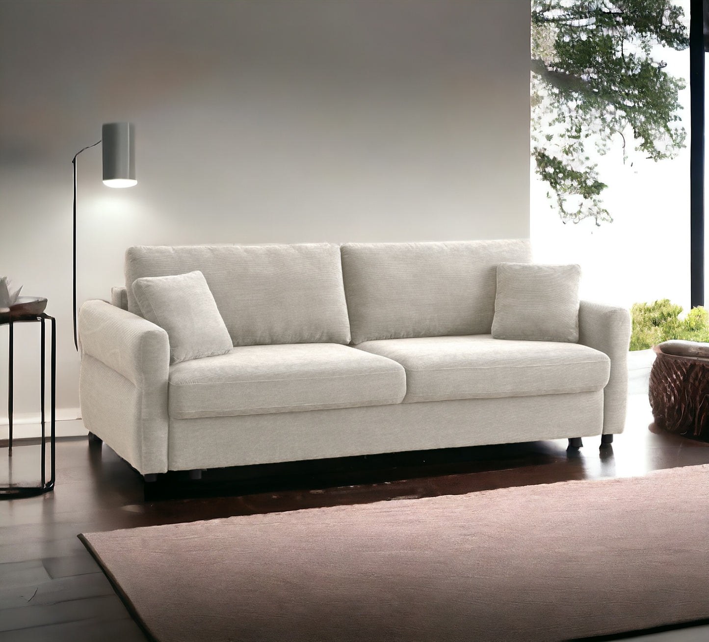 Light beige corduroy fabric couch with two plush seat cushions and three throw pillows