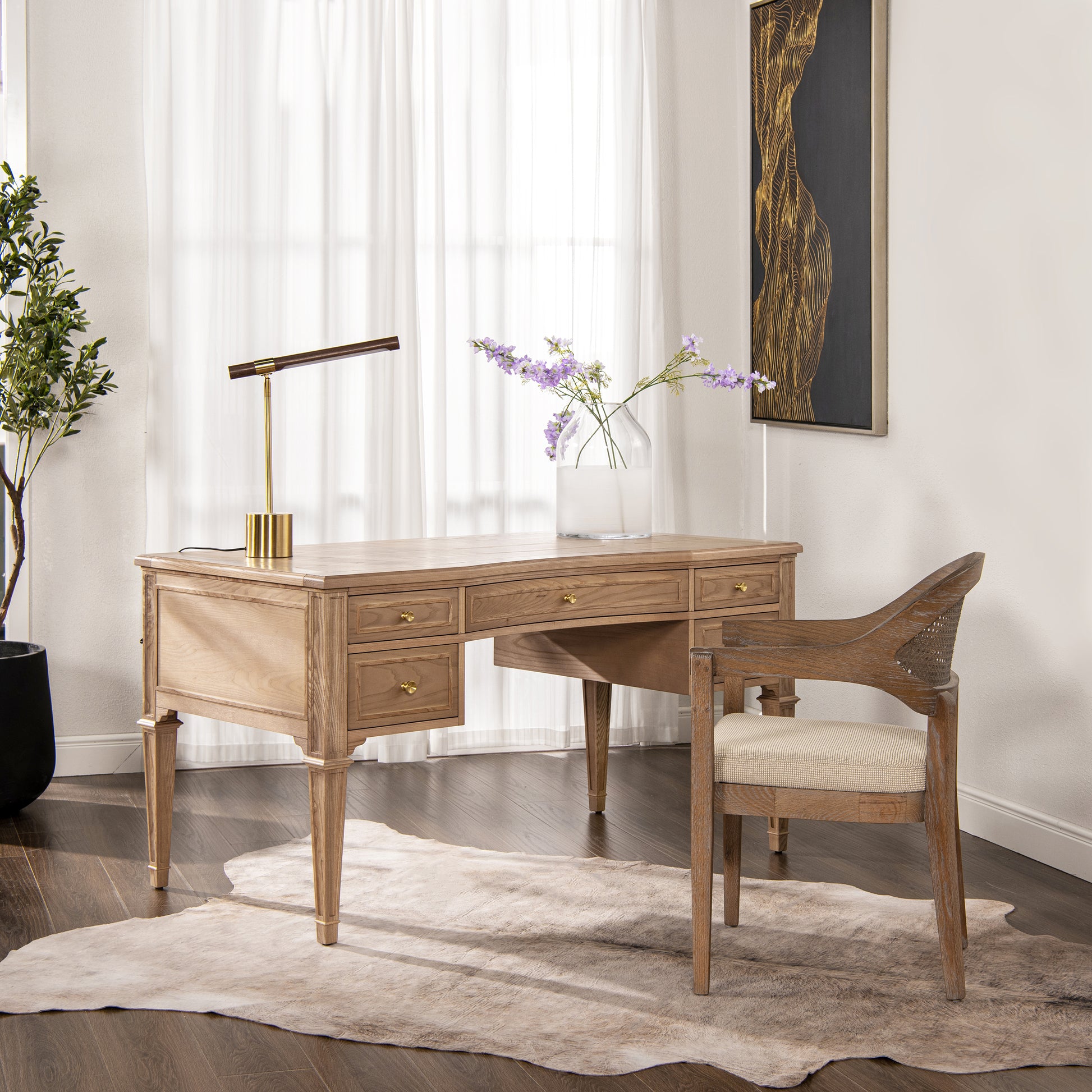 Light oak wood executive desk with brass hardware and matching canebacked chair