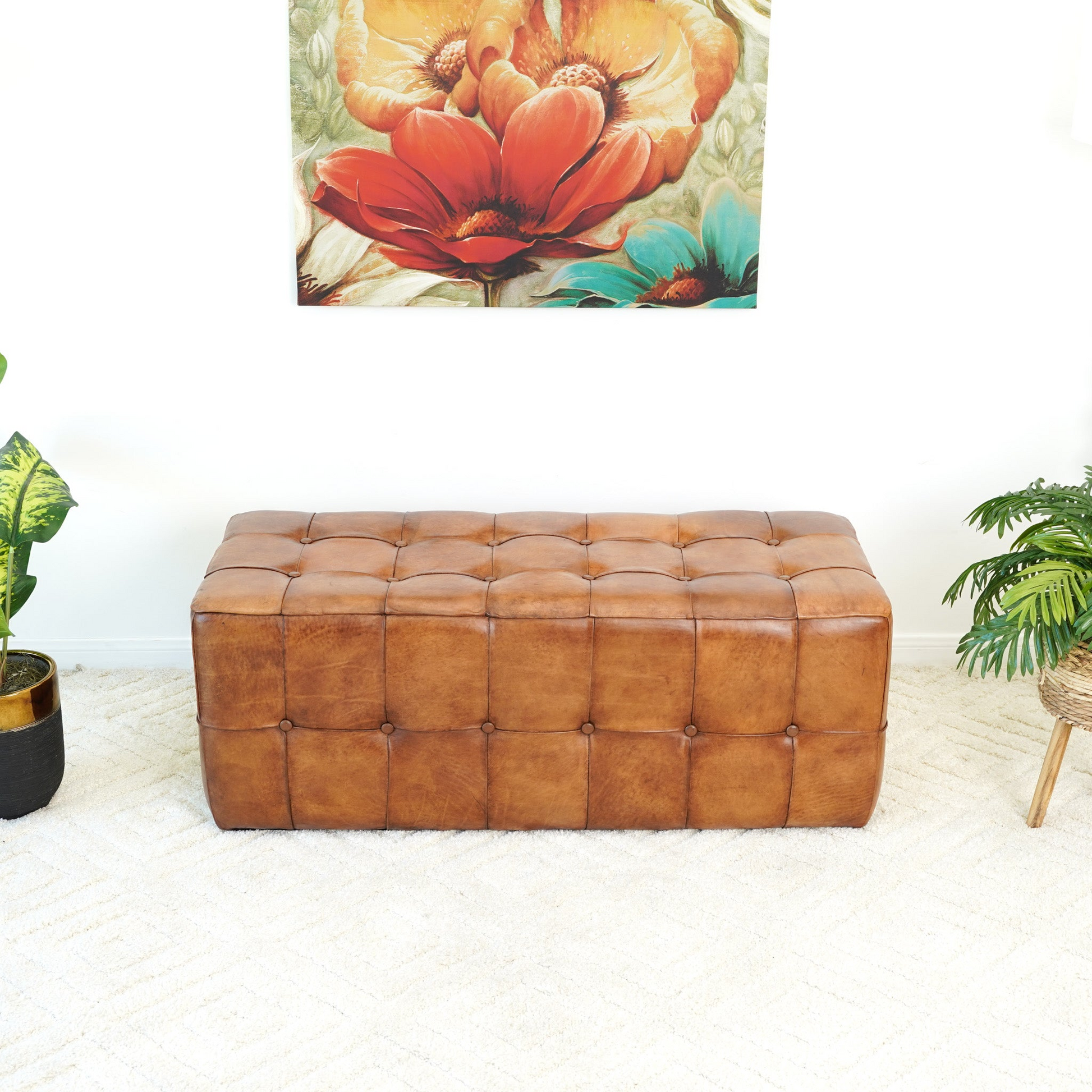 Tufted cognac leather storage ottoman ideal for living rooms and bedrooms offering stylish seating and hidden storage