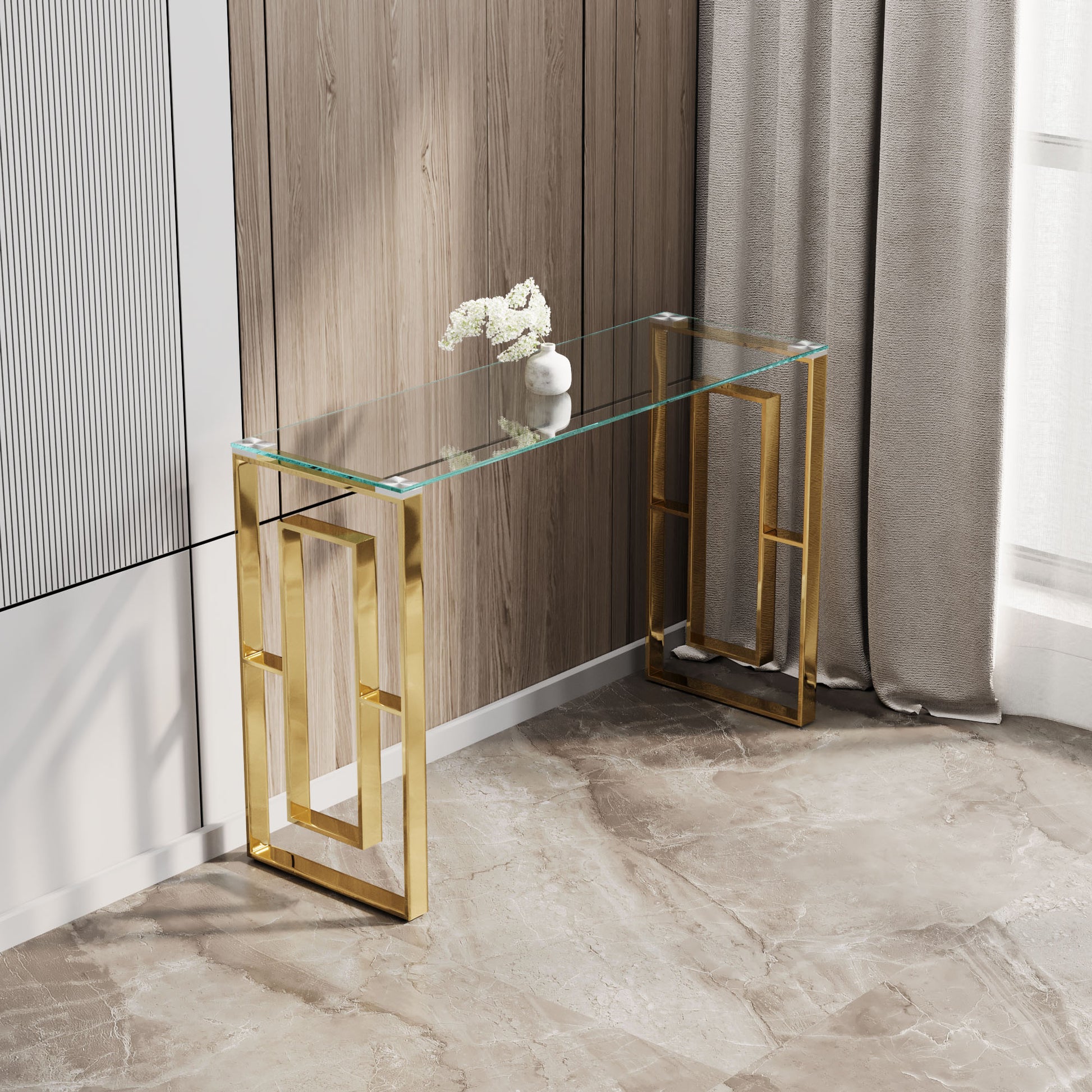 Modern gold console table with clear glass top and geometric legs