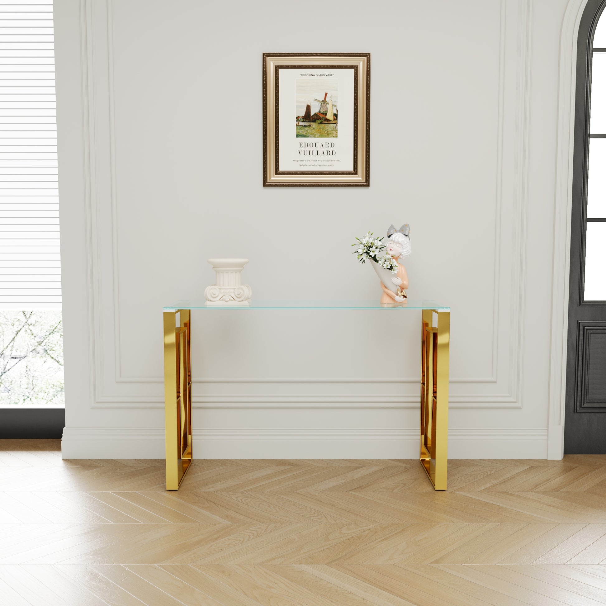 Sleek gold console table with clear glass top and geometric legs a modern accent piece