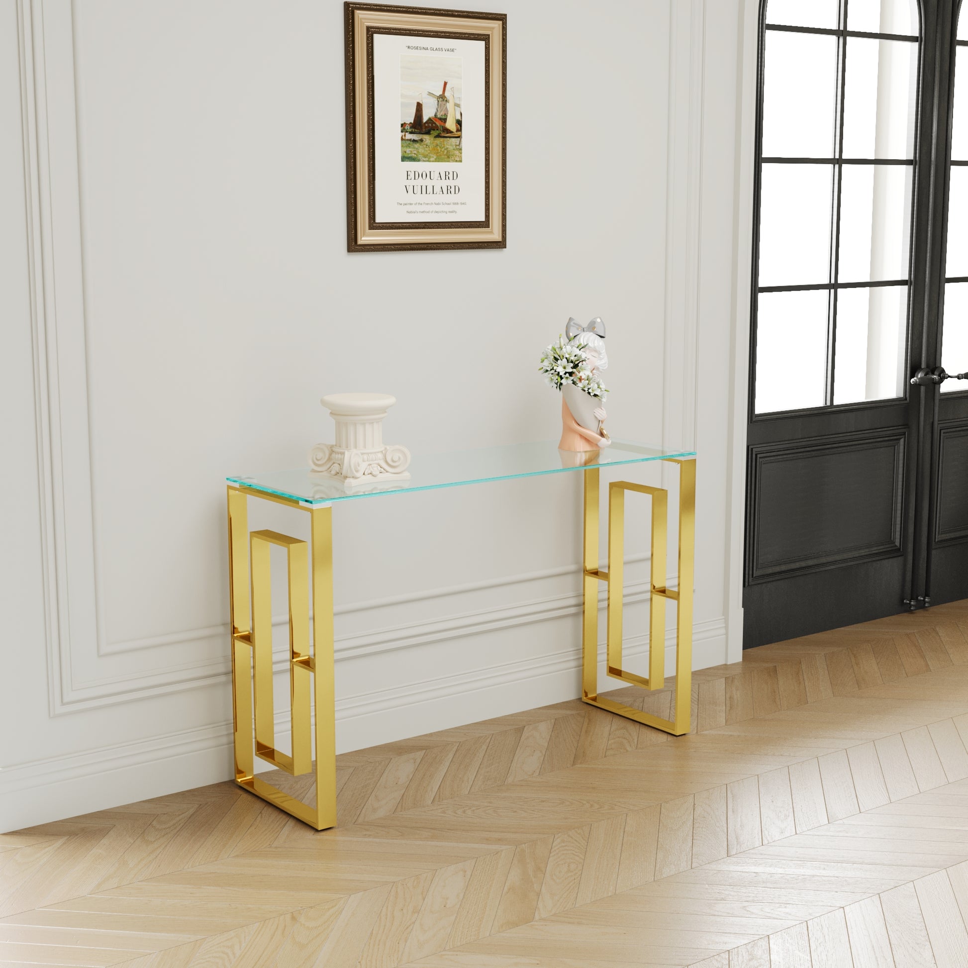 Gold console table with clear glass top and geometric base