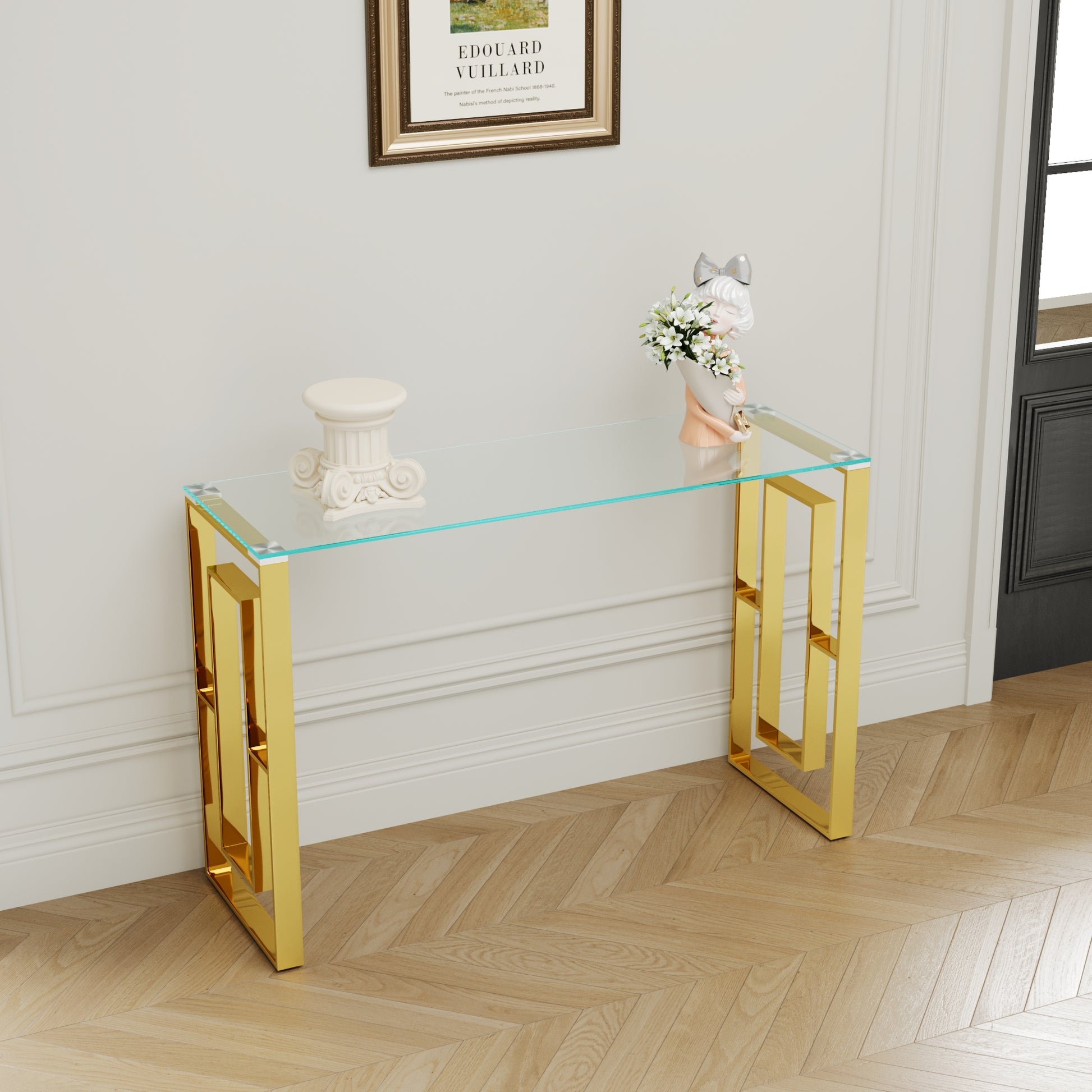 Sleek glass console table with a modern gold geometric base for entryway decor
