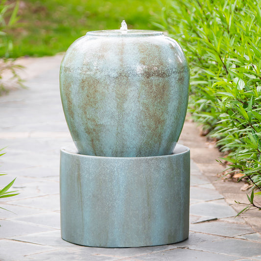 Aqua glazed ceramic garden fountain with a subtle rustic finish perfect for tranquil outdoor spaces