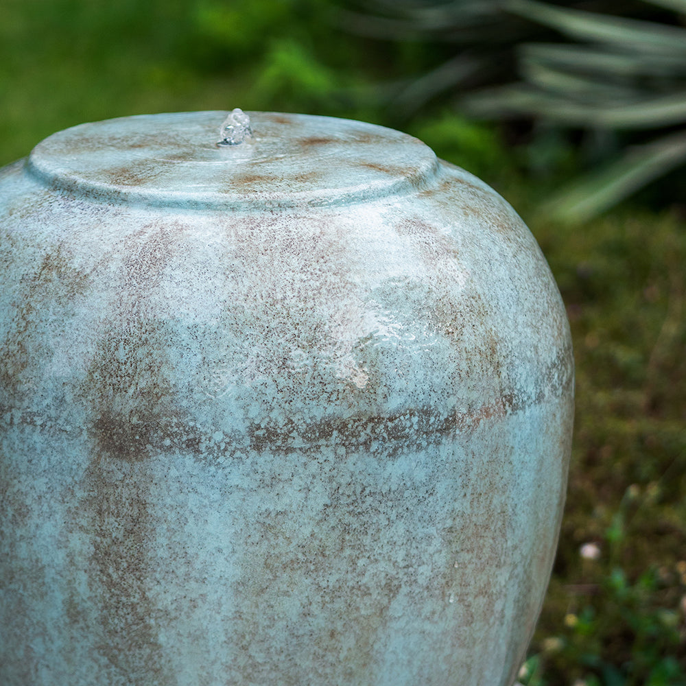 Glazed ceramic garden fountain with water jet soft blue and brown textured finish
