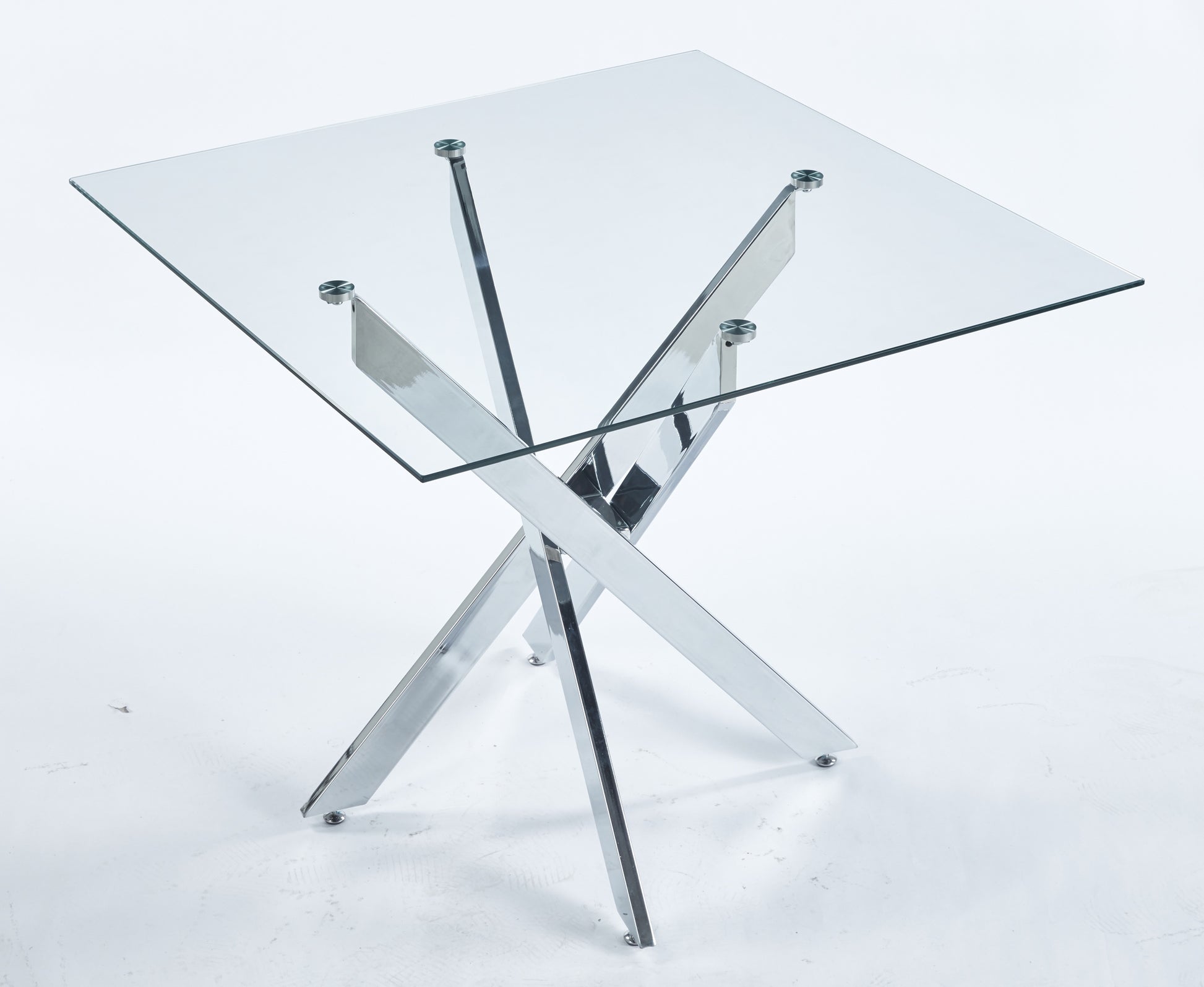 Modern glass side table with polished chrome crossed legs ideal for living rooms