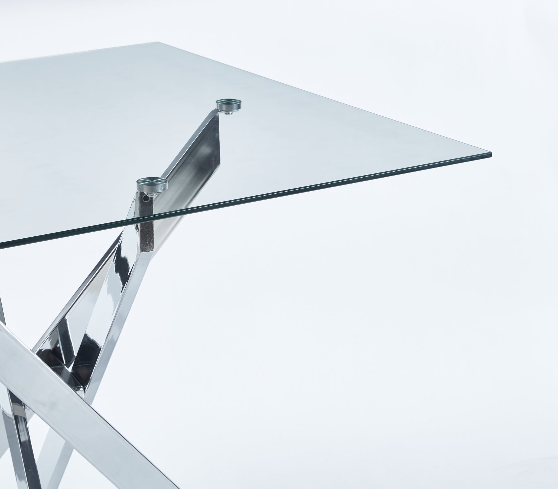 Clear glass table with polished chrome Xshaped legs modern design