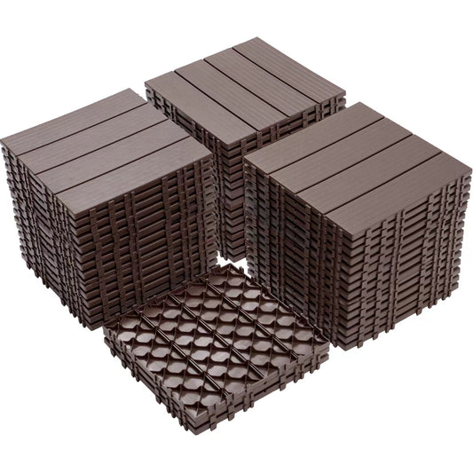 Four stacks of dark brown interlocking composite deck tiles with a woodgrain texture on top
