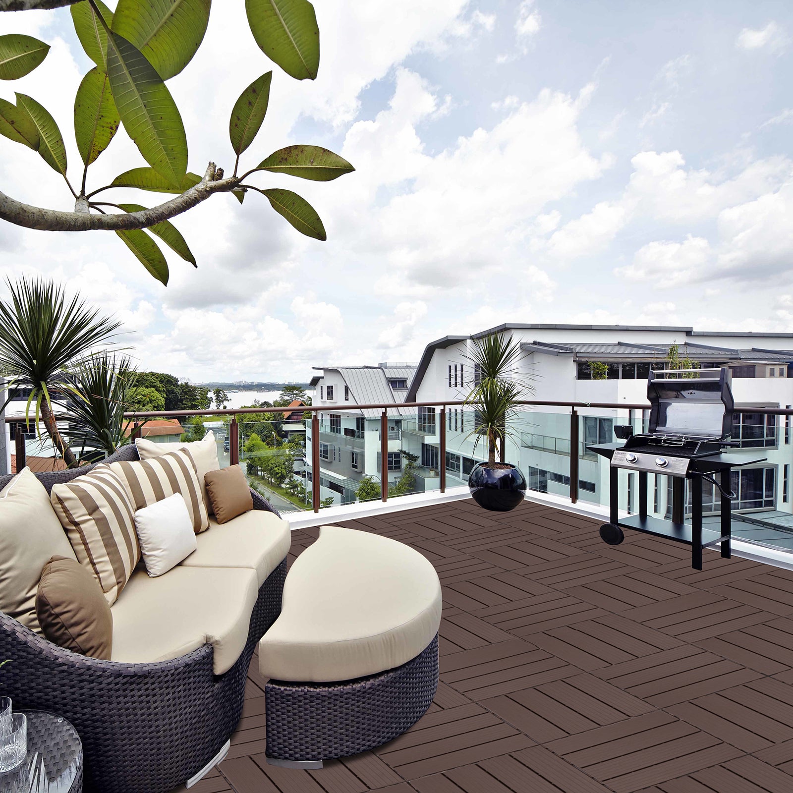 Woven wicker sectional sofa with beige cushions and striped pillows for outdoor seating