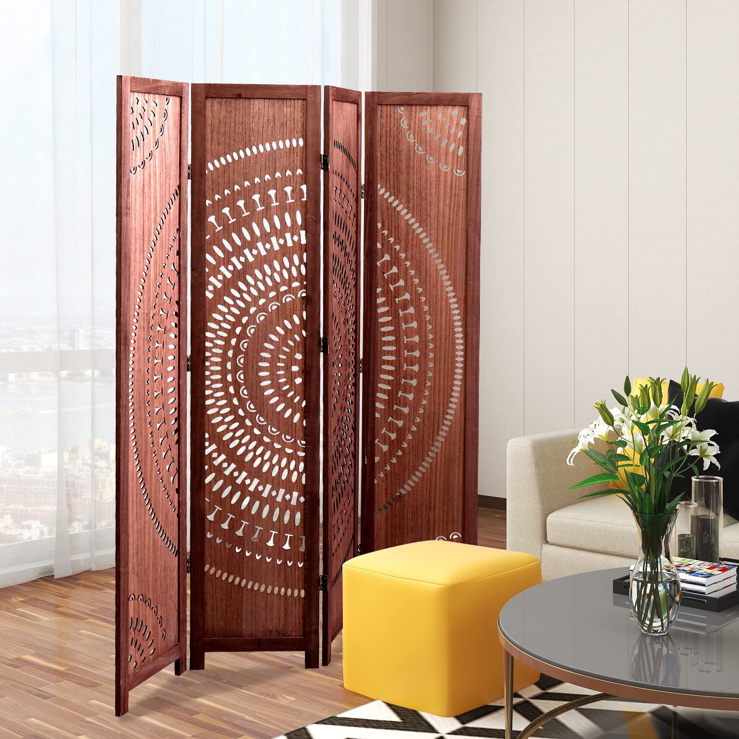 Fourpanel wood room divider with intricate circular cutouts adding privacy to a modern living space