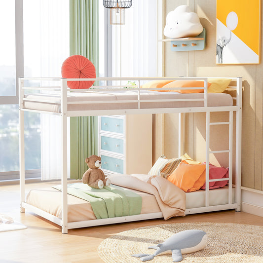 White metal twinovertwin bunk bed with colorful pillows and a teddy bear