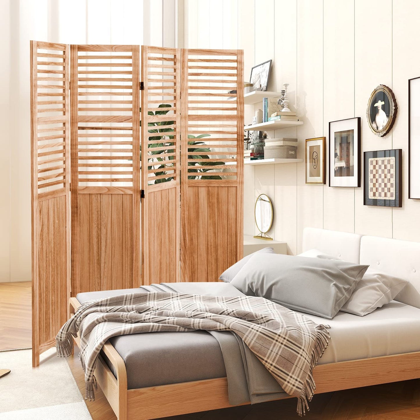 Natural wood folding screen room divider with louvered panels adding privacy to bedroom