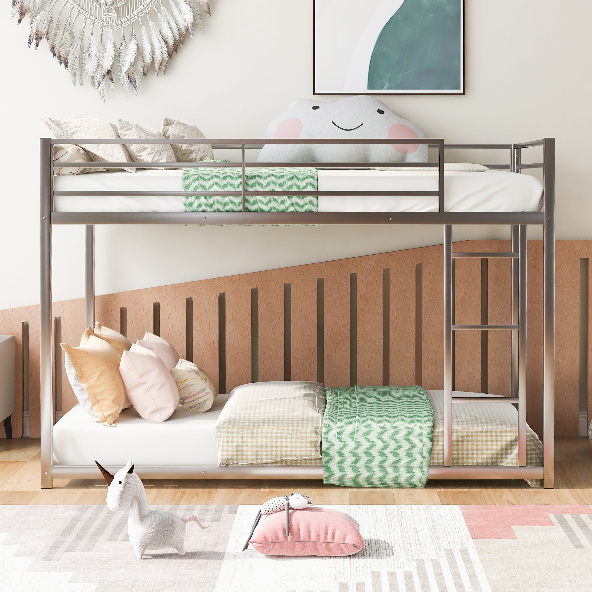 Silver metal twin over twin bunk bed with white mattresses and colorful pillows