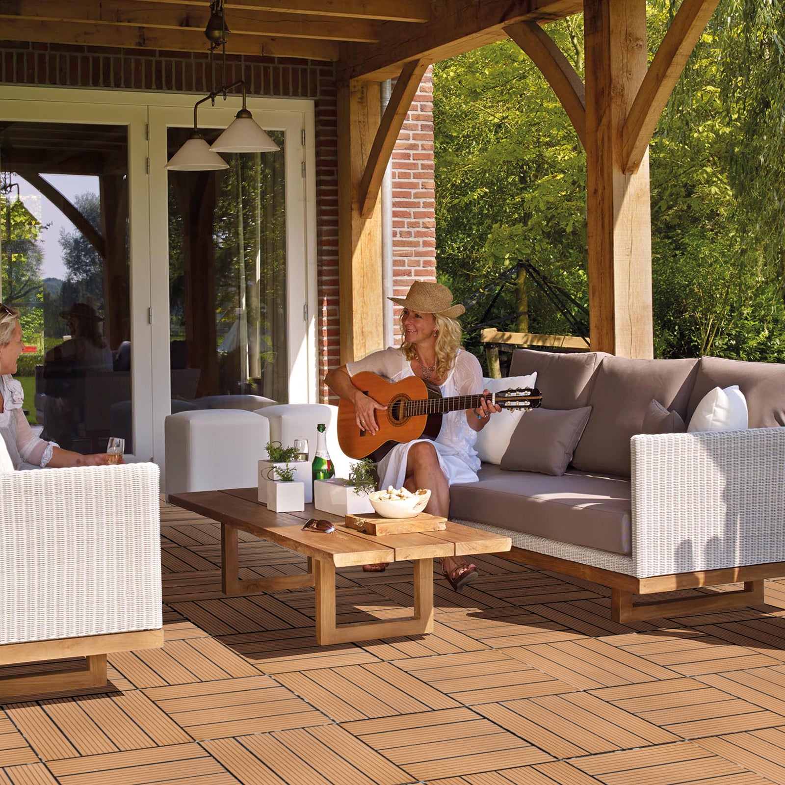 Brown composite deck tiles in a modern patio setting with outdoor furniture
