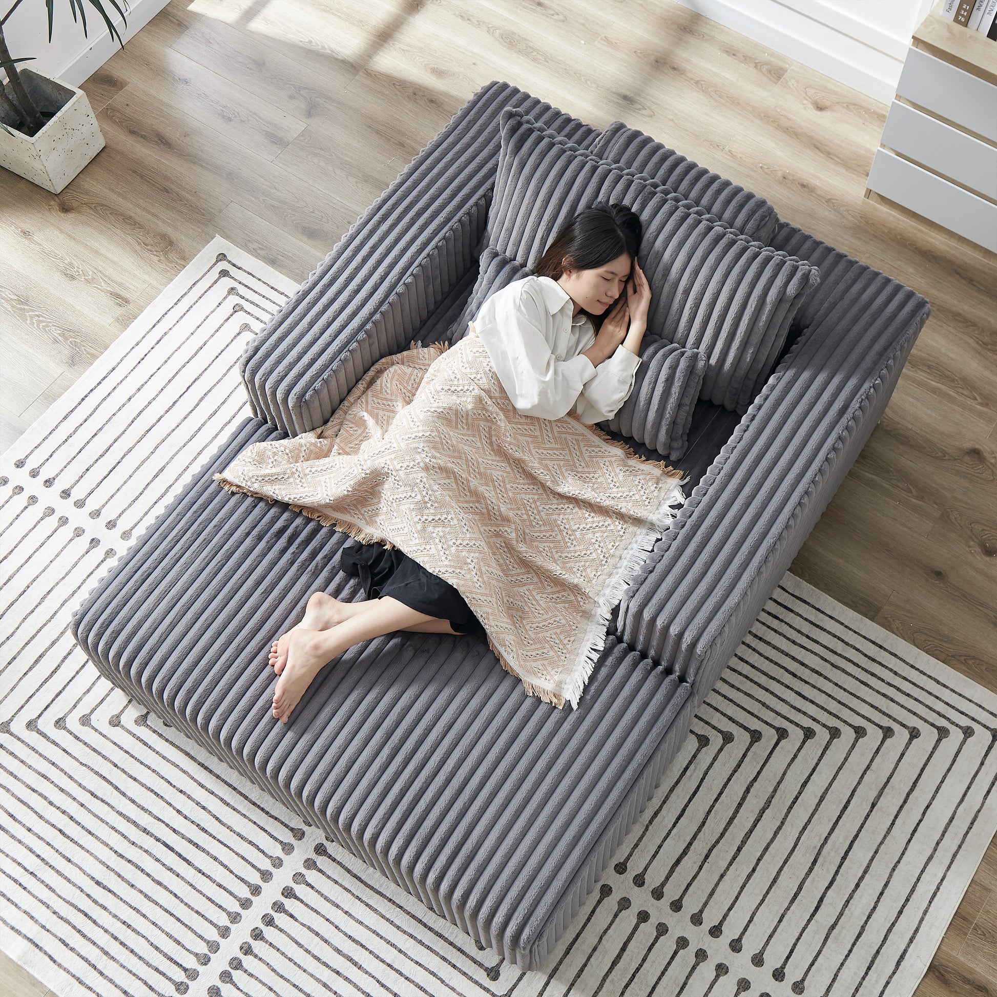 Gray corduroy sectional sofa with plush cushions perfect for modern living rooms
