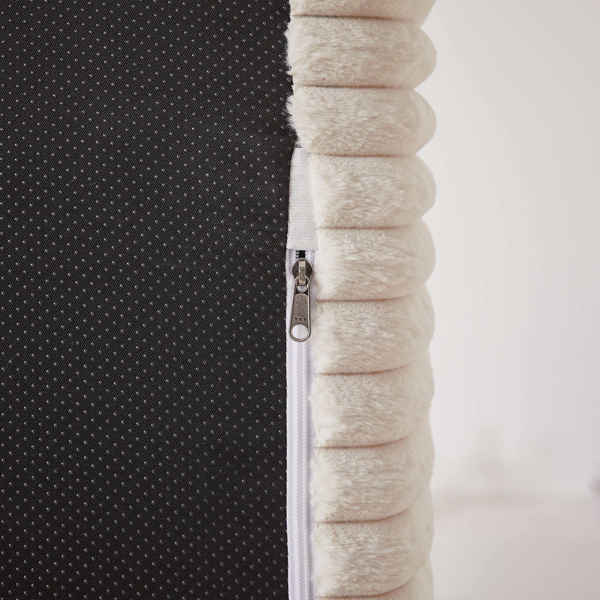 Cream plush dog bed cover with zippered closure and nonslip backing detail