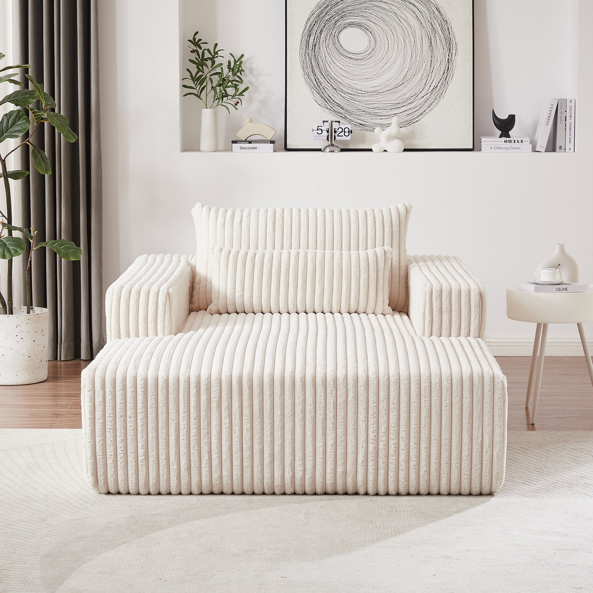 Plush cream corduroy armchair with matching ottoman offering a cozy seating option