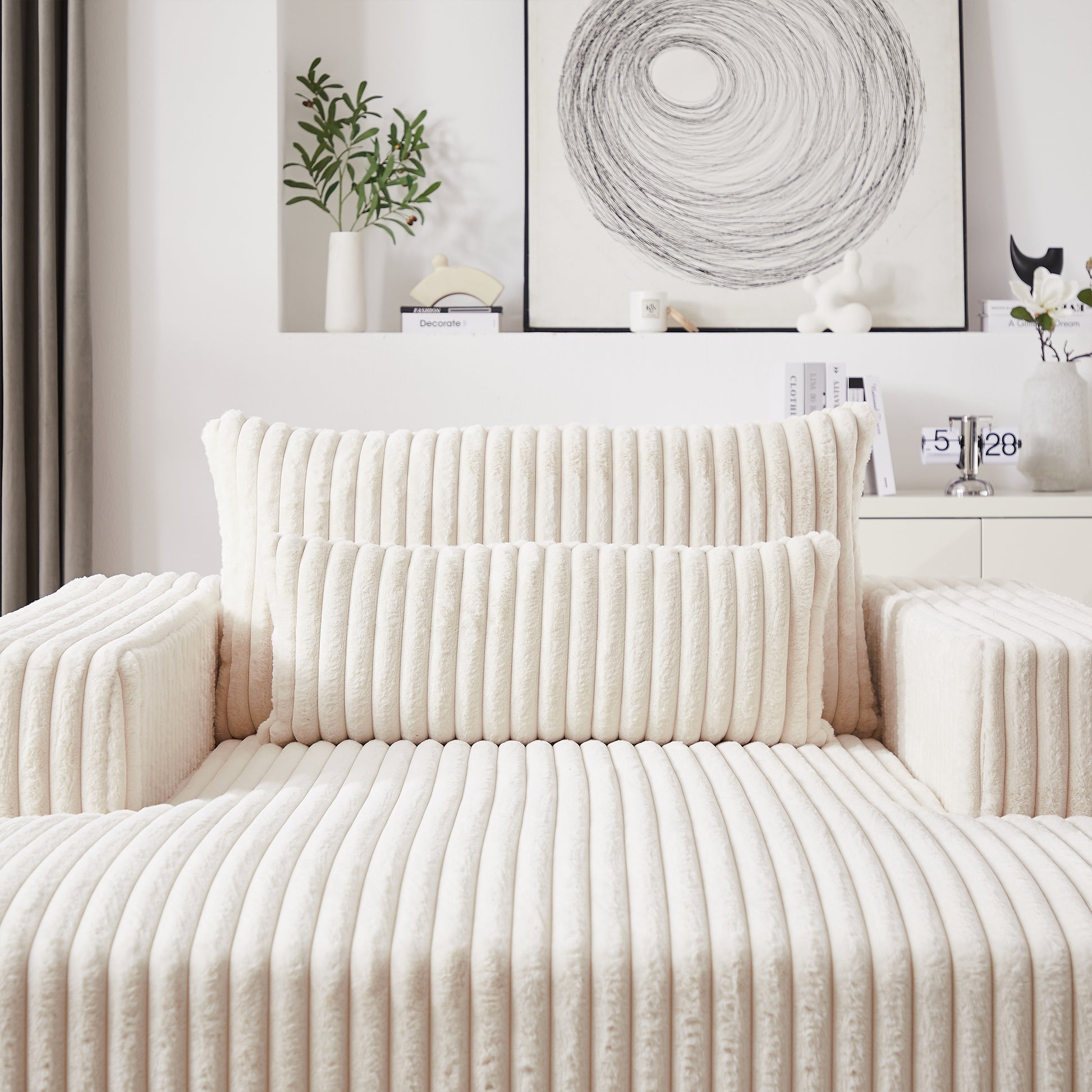 Cream corduroy sofa with plush cushions for ultimate comfort