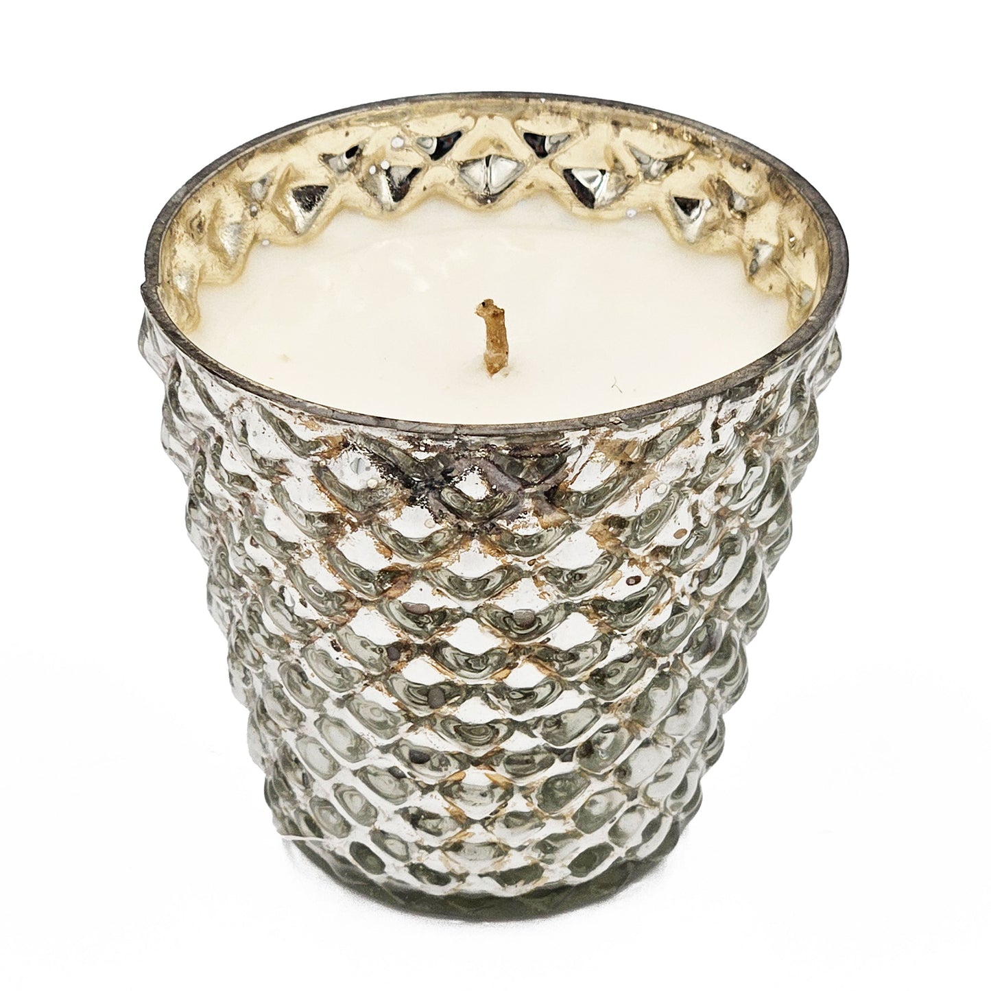 Textured mercury glass scented candle with a rustic charm and warm ambient glow