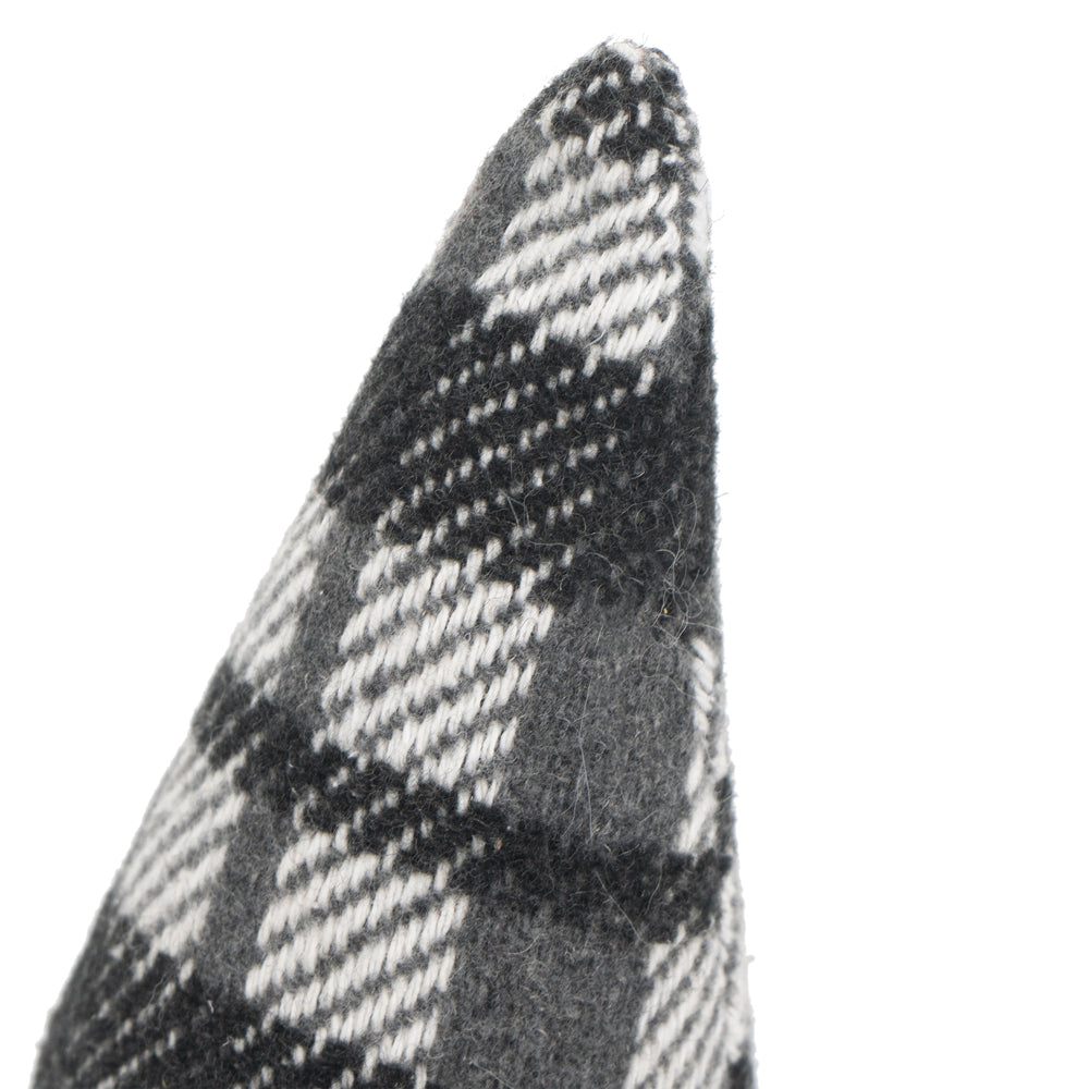 Closeup of grey and white plaid textured fabric on a conical shape