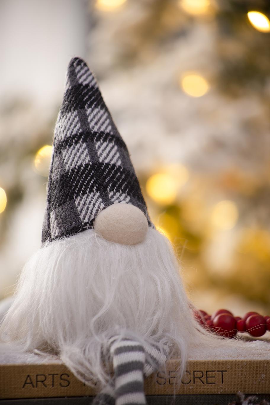 Tartan plaid gnome with white beard and striped legs a festive holiday decoration