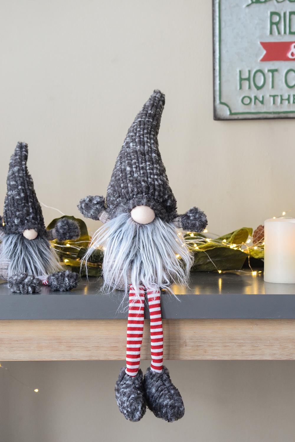 Plush gnome decoration with gray knit hat and whitered striped legs