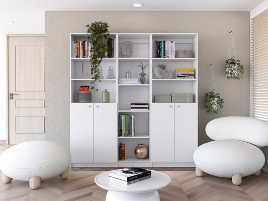 White modern bookcase with multiple shelves displaying books and decor