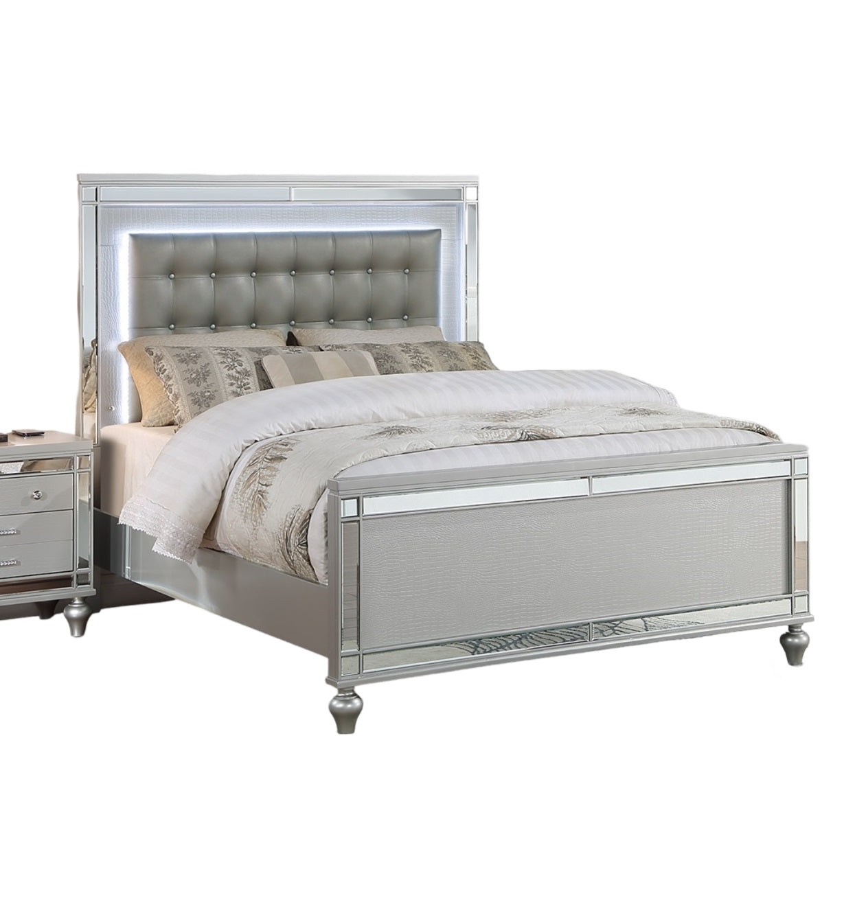 Silver tufted leather bed frame with integrated LED lighting and mirrored accents