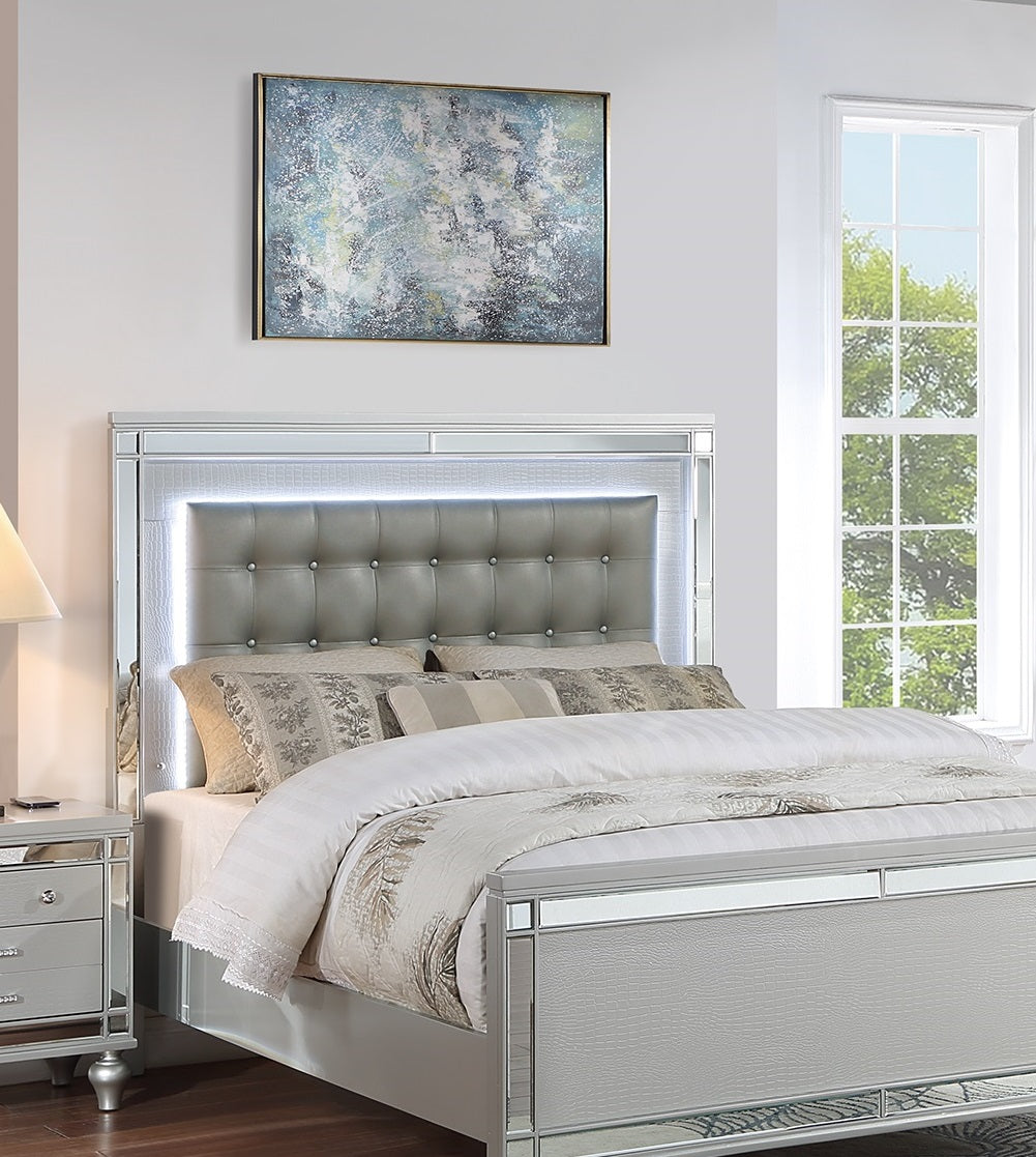 Modern grey upholstered king bed frame with integrated LED lighting and mirrored trim