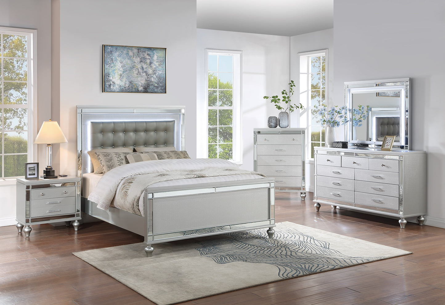 Glamorous silver queen bed with tufted upholstered headboard and LED lights