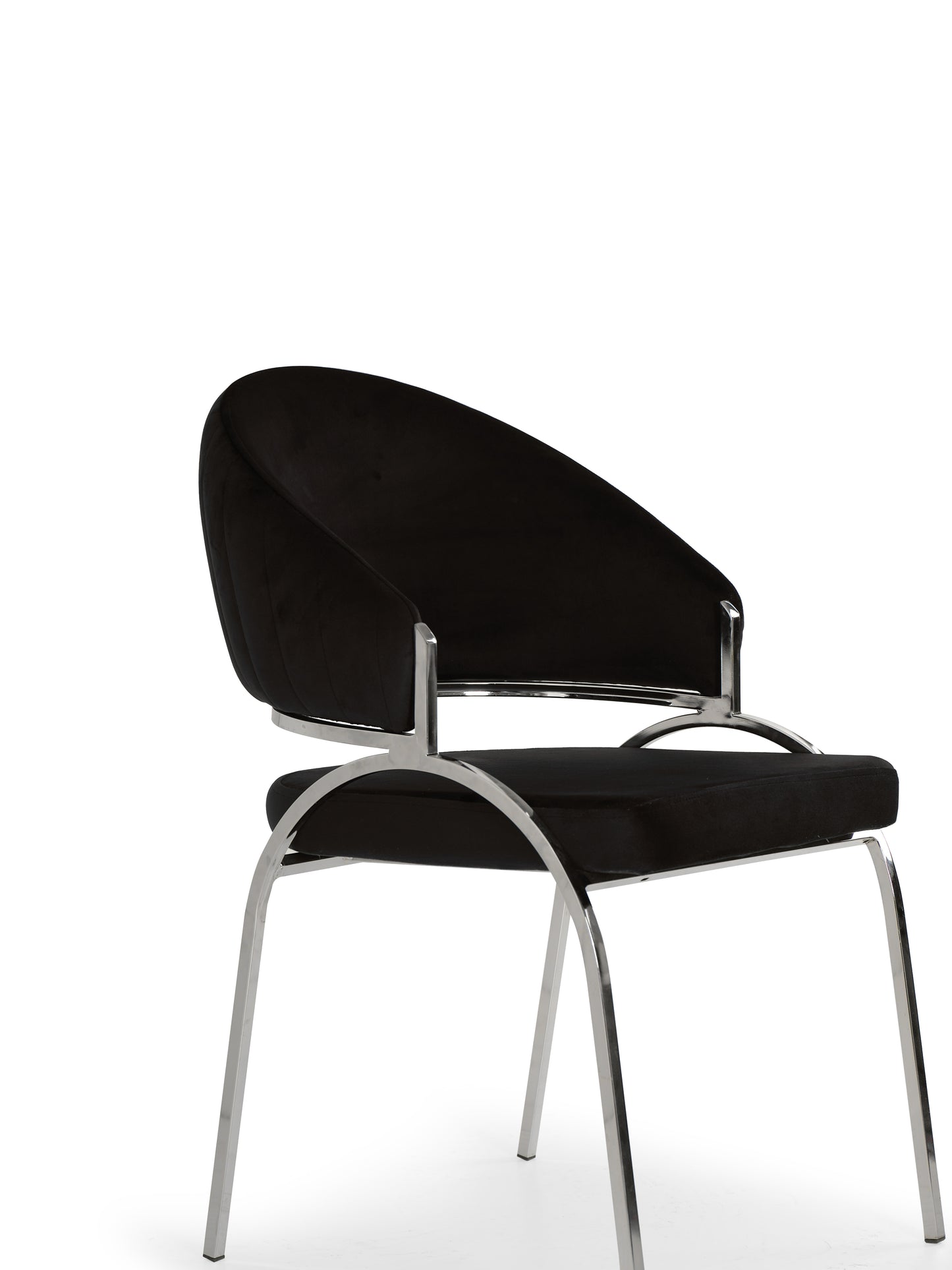 Black velvet dining chair with curved back and chrome legs