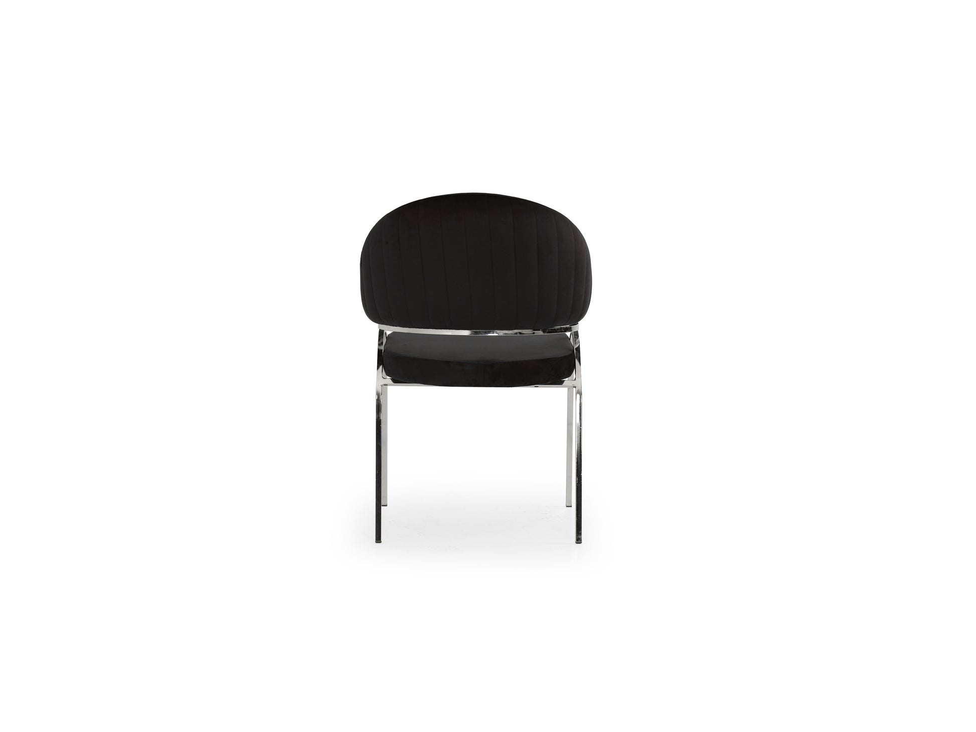 Black velvet dining chair with vertical tufting and chrome legs