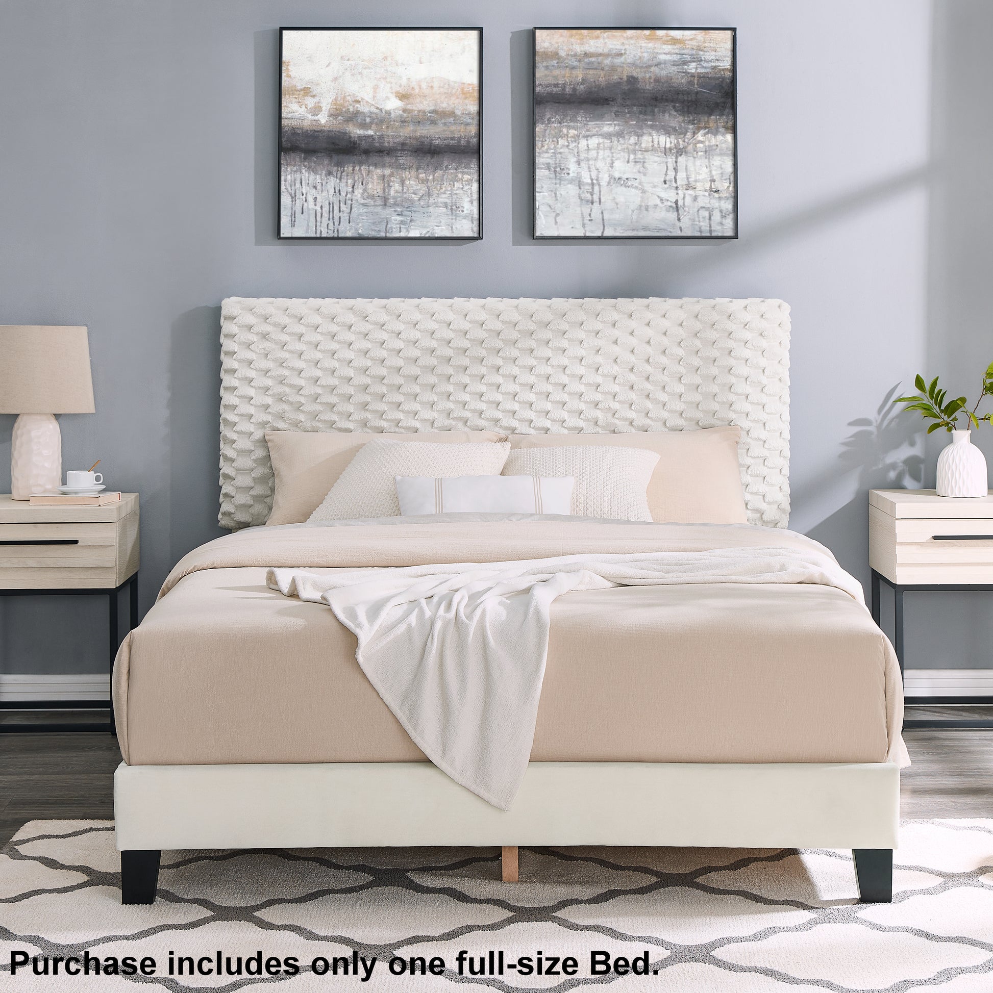 Textured white upholstered king size bed with neutral bedding