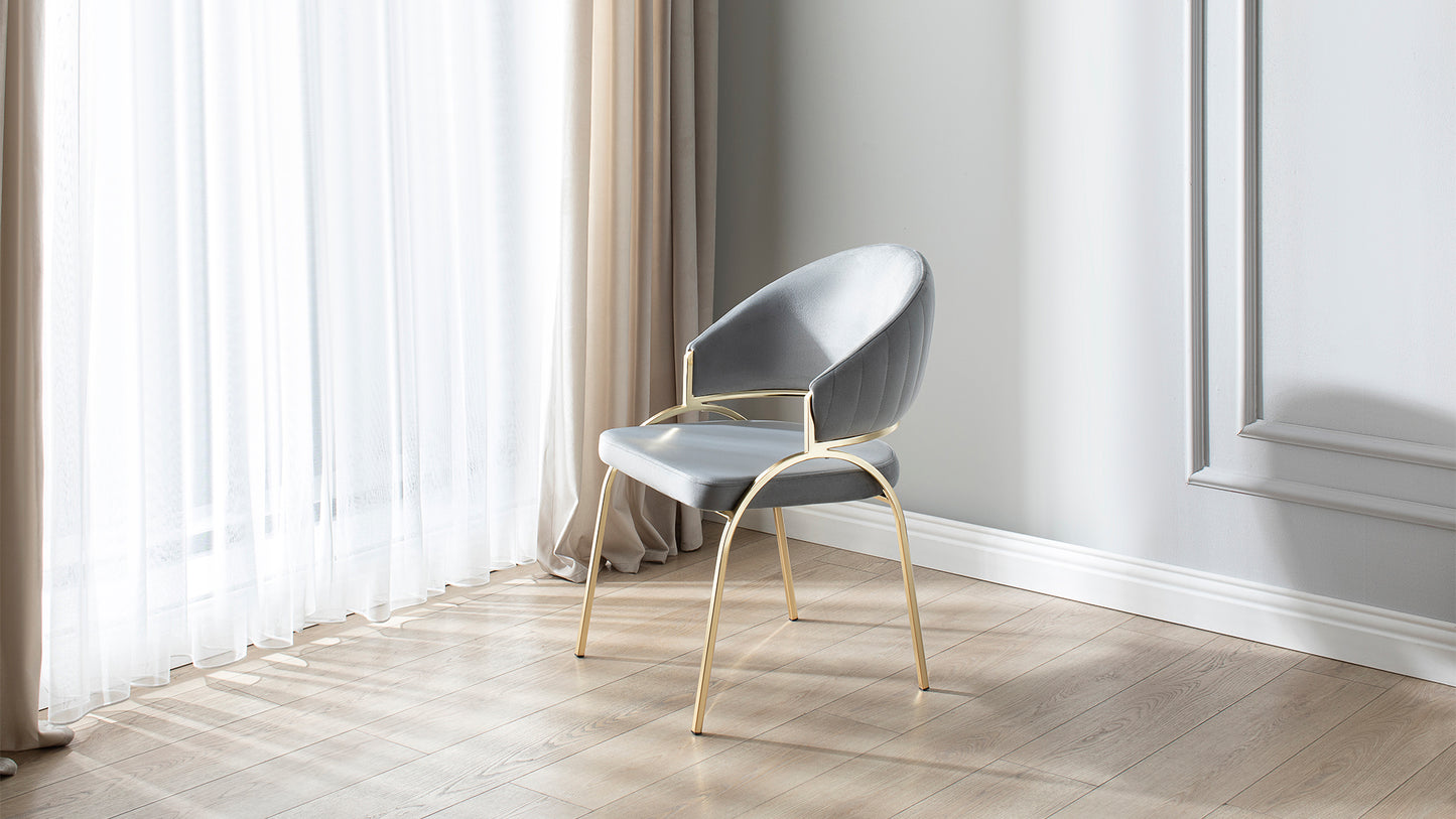 Grey velvet dining chair with gold legs and quilted backrest modern design